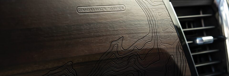 2022 GMC Sierra Topographical map patterns of Mt. Denali’s summit laser-etched and embossed along with authentic open-pore Paldao wood across the interior.