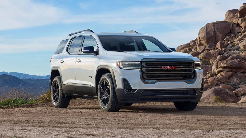 2023 GMC Sierra AT4 parked on a hilltop.