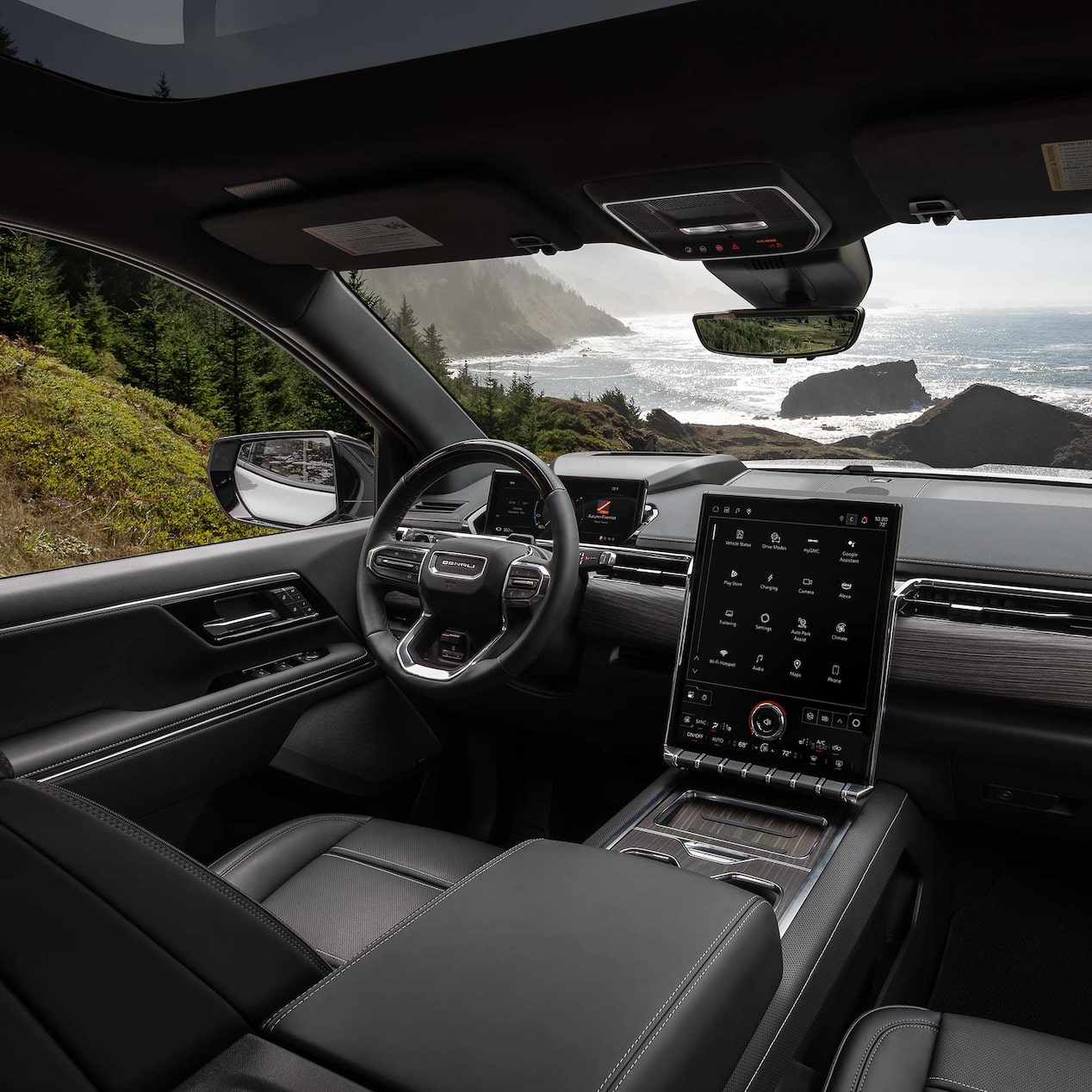 Interior View of the steering wheel and infotainment screen inside the Sierra EV Pickup Truck.