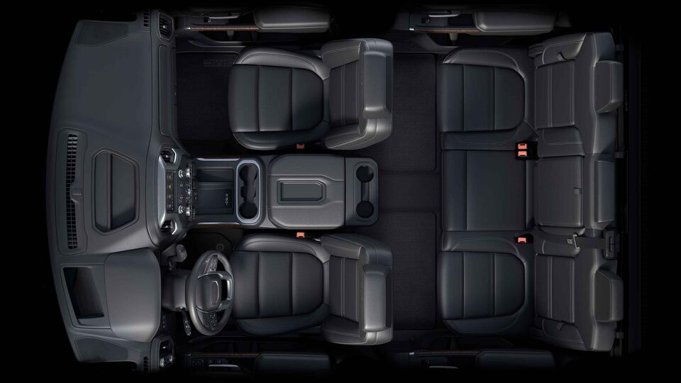Bird's-eye view of the 2022 Sierra HD interior jet black front seating.