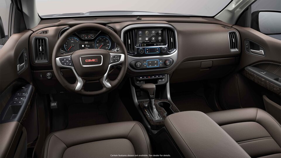 Front interior view of the 2022 GMC Canyon in Cocoa & Dark Atmosphere Leather-appointed seats.
