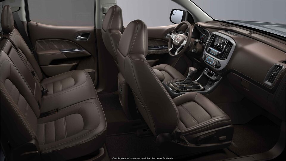 Side interior view of the 2022 GMC Canyon in Cocoa & Dark Atmosphere Leather-appointed seats.