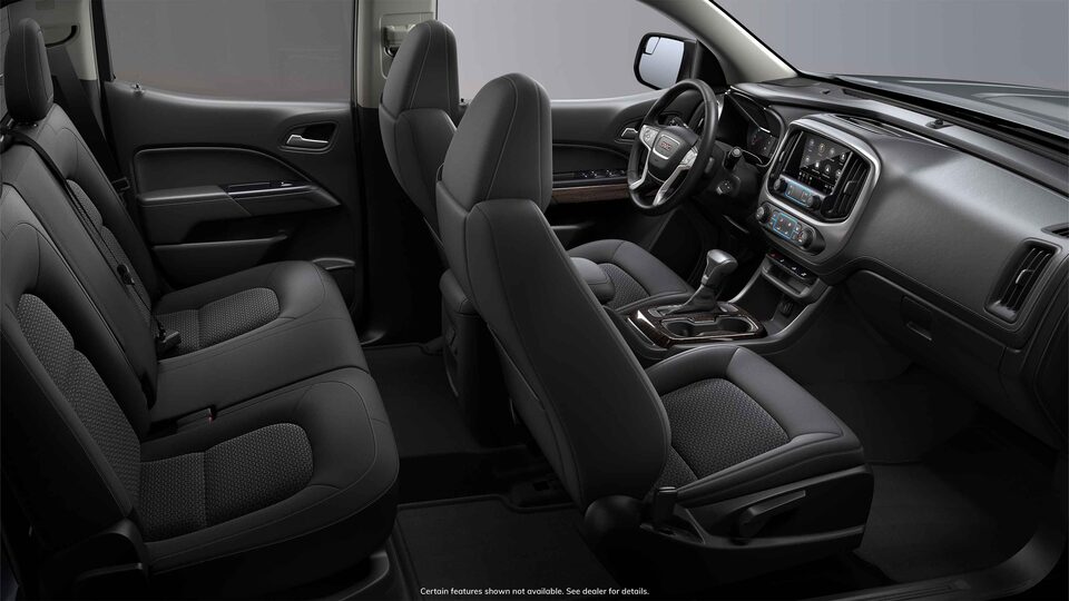Vue latérale de l'intérieur avant du GMC Canyon 2022 en tissu noir jais.