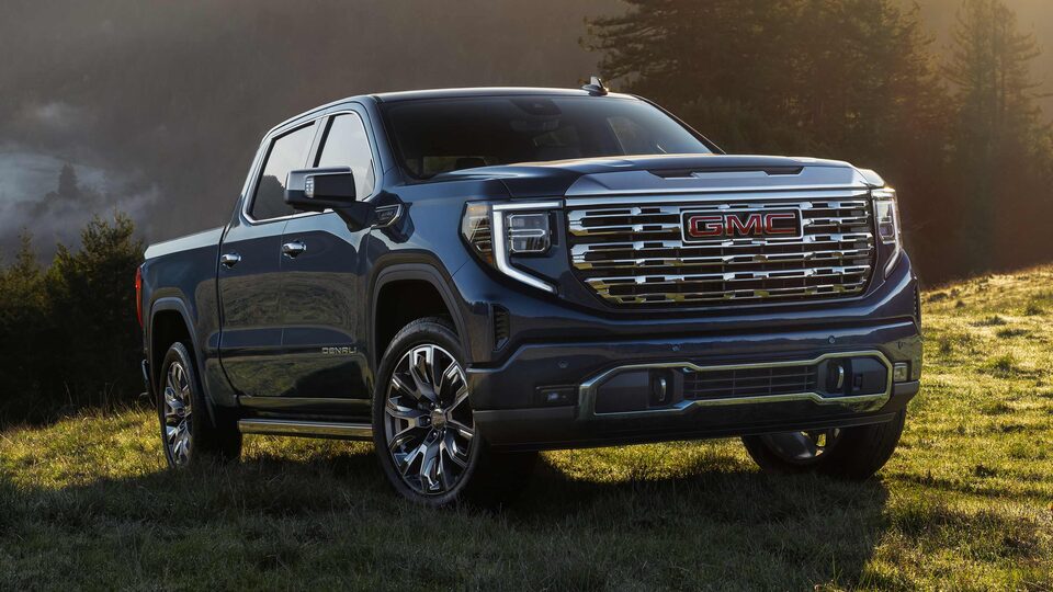 2023 GMC Sierra 1500 Denali on green grass.