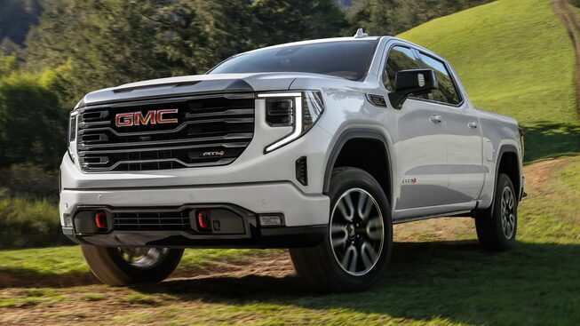 2023 Sierra 1500 AT4 parked in a grass field.