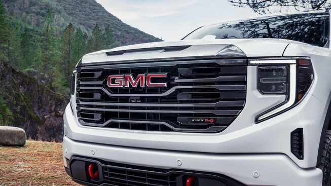 The front grille and headlight design of the GMC Sierra AT4.