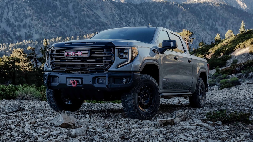 The First Ever 2023 Sierra 1500 AT4X AEV Edition parked on rocky ground.