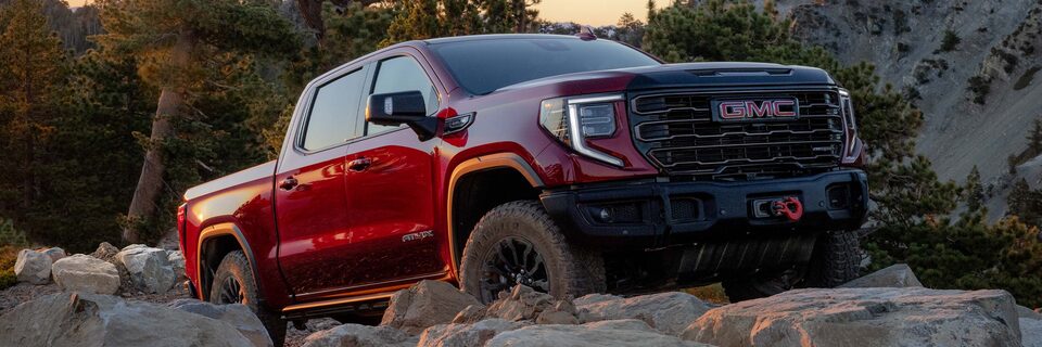 The New AEV-inspired 2023 Sierra 1500 AT4X on rough terrain.
