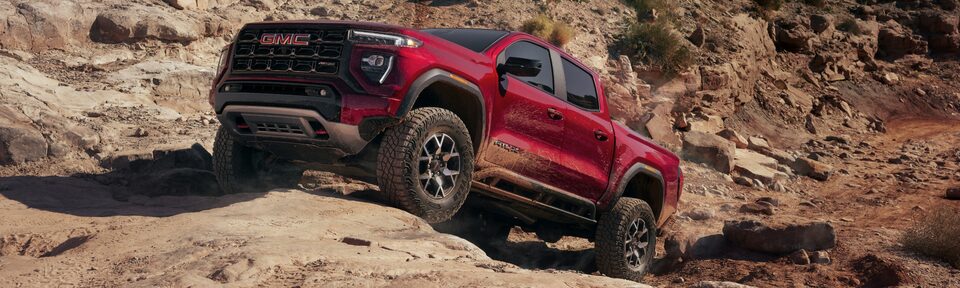 2023 GMC Canyon AT4X driving uphill.