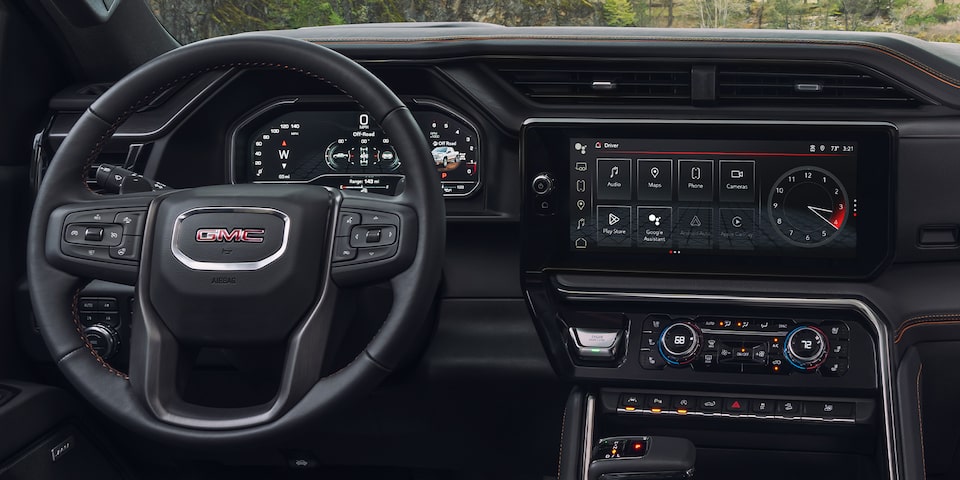 Steering wheel and infotainment system of the 2024 GMC Sierra 1500 AT4.