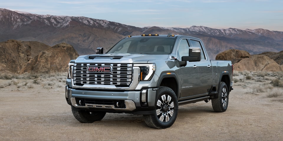 The 2024 GMC Sierra HD in front of the mountains.
