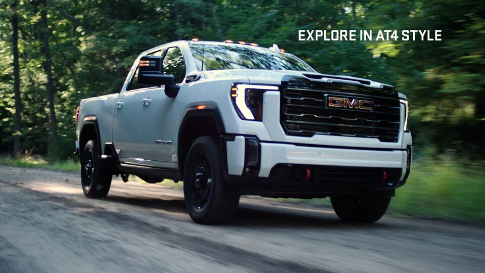 Front right profile view of the 2024 Sierra HD AT4: Premium Off-Roading.