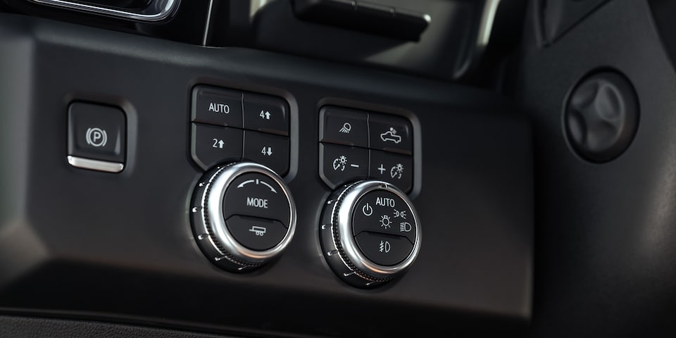 Traction mode controls on the interiors of the 2024 GMC Sierra 1500 Denali.