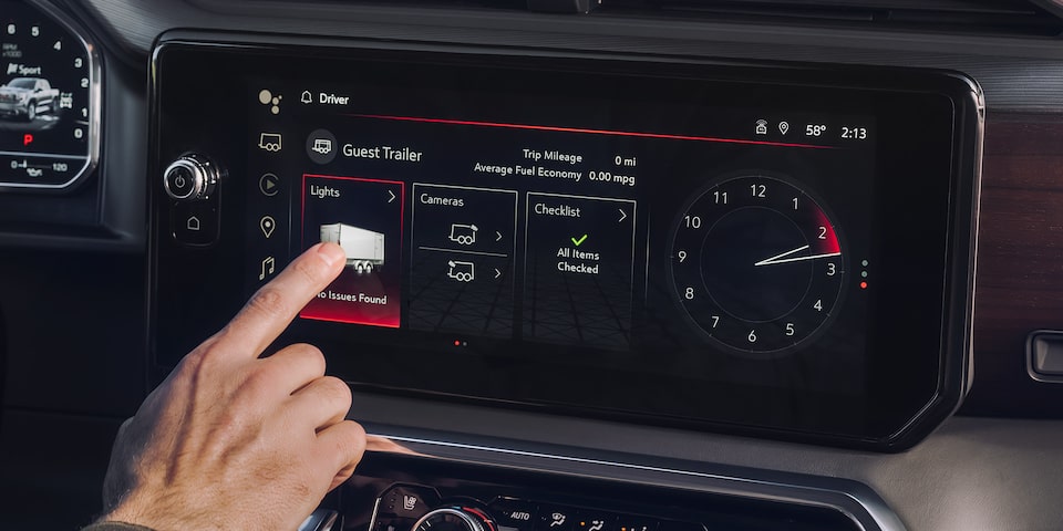 A person utilizing the In-Vehicle Trailering App of the 2024 GMC Sierra 1500 Denali.