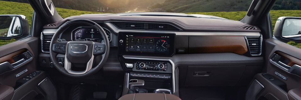 Passenger seat perspective of the interiors of the 2024 GMC Sierra 1500 Denali.