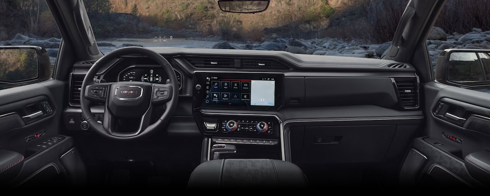 Rear passenger's perspective of the interiors of the 2024 GMC Sierra 1500.