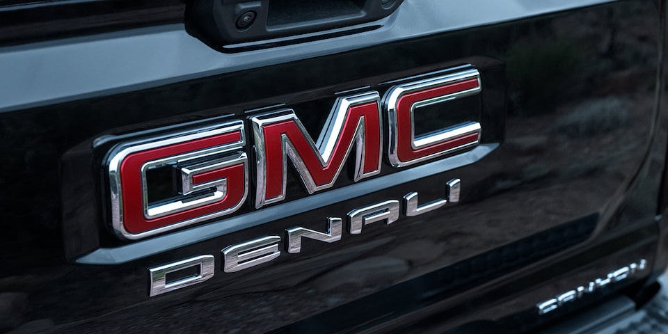 Close-up view of the Exclusive Badging on the 2025 GMC Canyon Denali Tailgate.