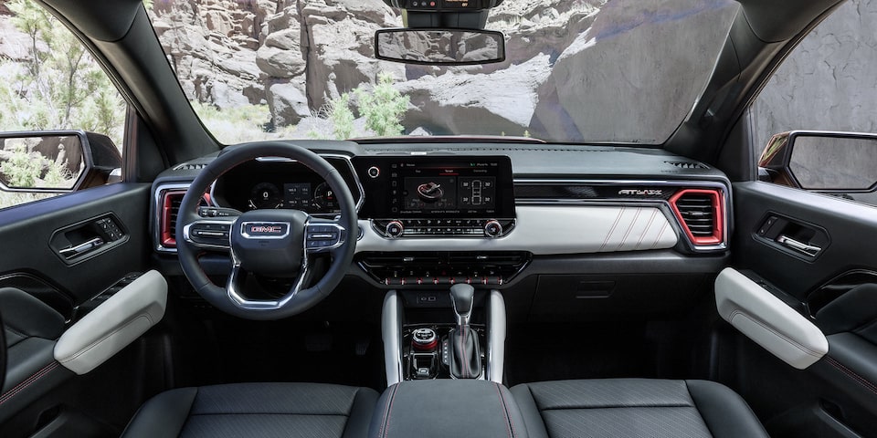 The Driver's Seat View of the 2025 GMC Canyon Steering Wheel and Dashboard.