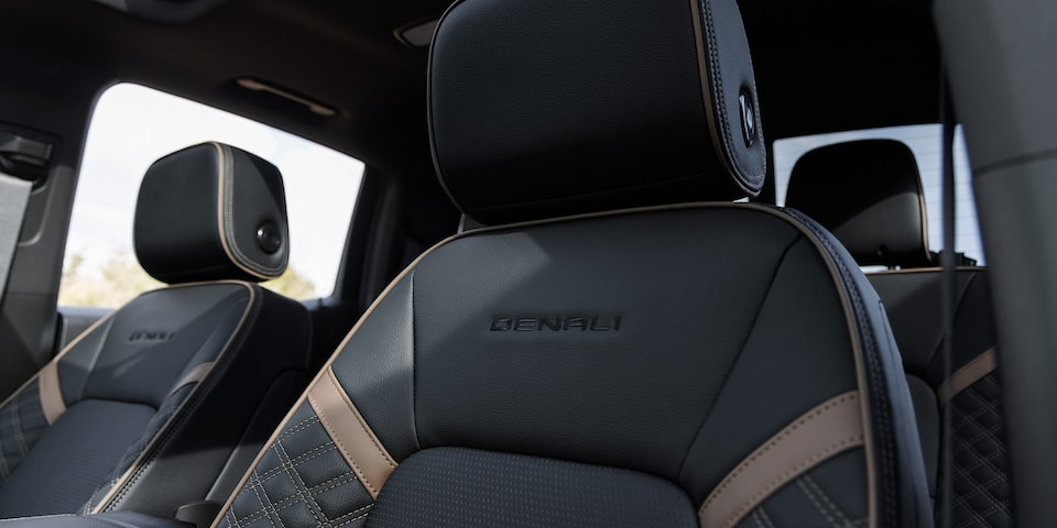 Close-up view of the 2025 GMC Canyon Denali Front Row Leather Seats with Trim Printed on Seat.