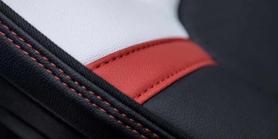 Close-up view of the 2025 GMC Canyon Premium Materials and Red Stitching.