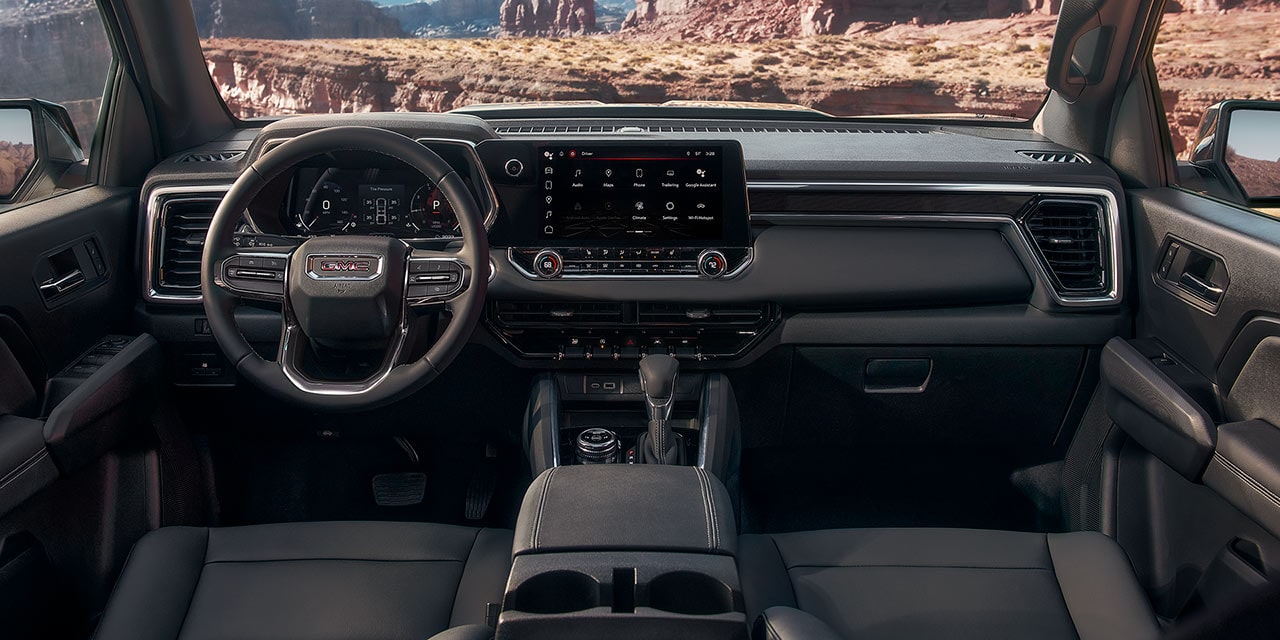 Comfortable front interiors of the 2026 GMC Canyon Elevation.
