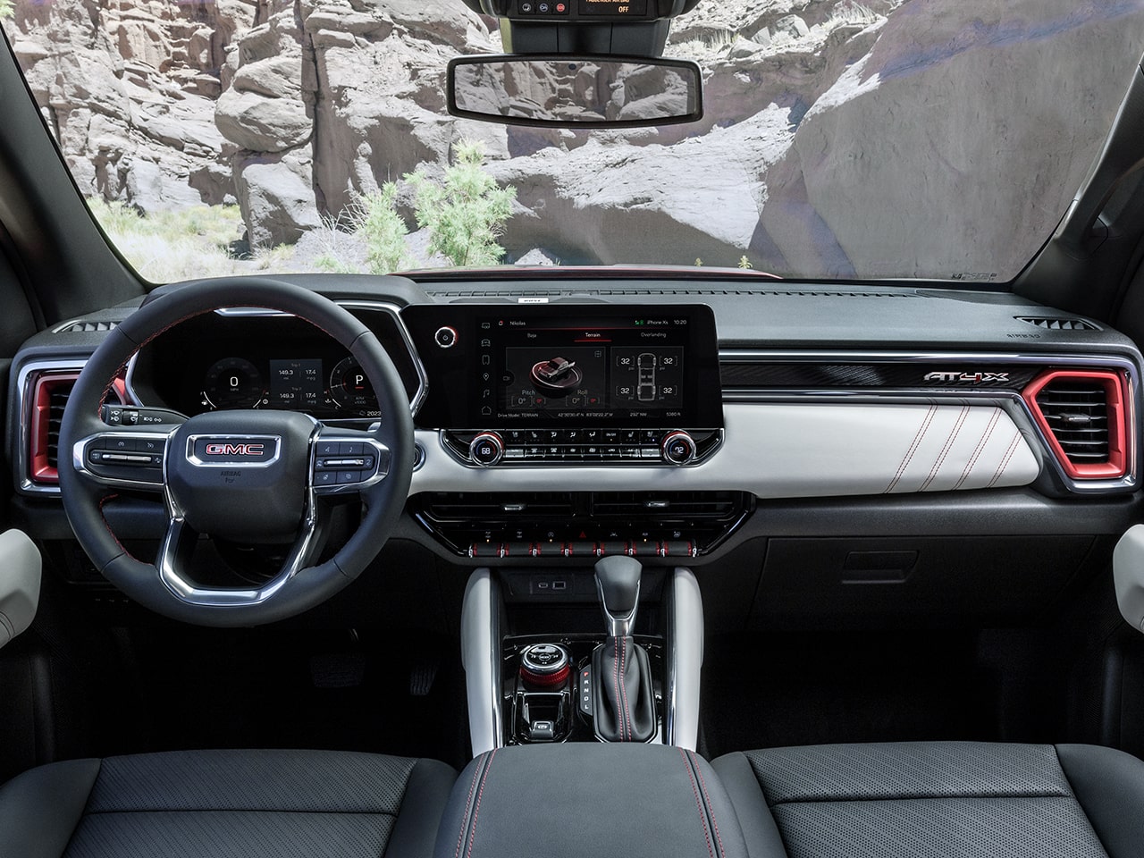 Front interiors of the 2026 GMC Canyon AT4X with Obsidian Rush interiors.
