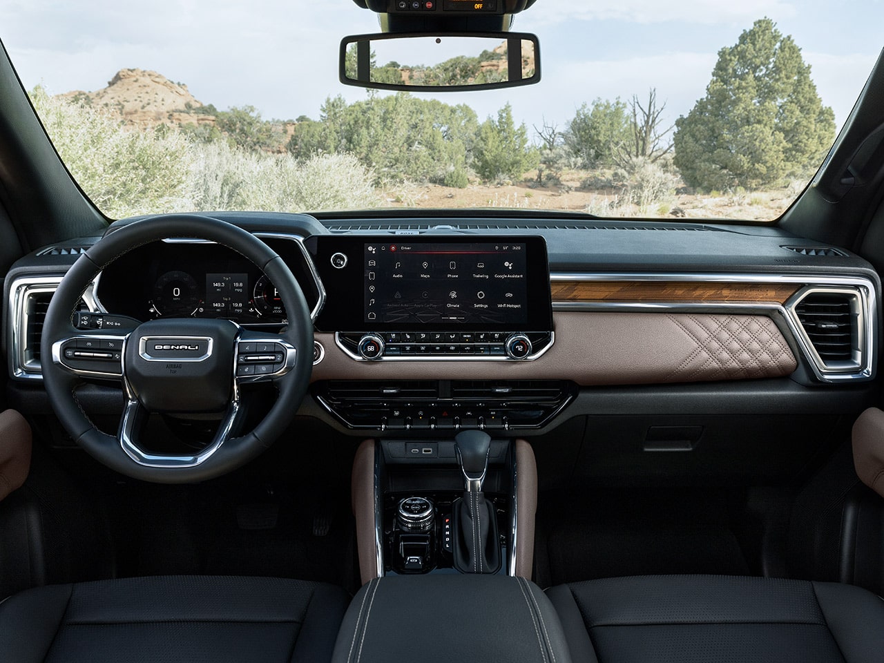 Front interiors of the 2026 GMC Canyon Denali with Teak interior accents.