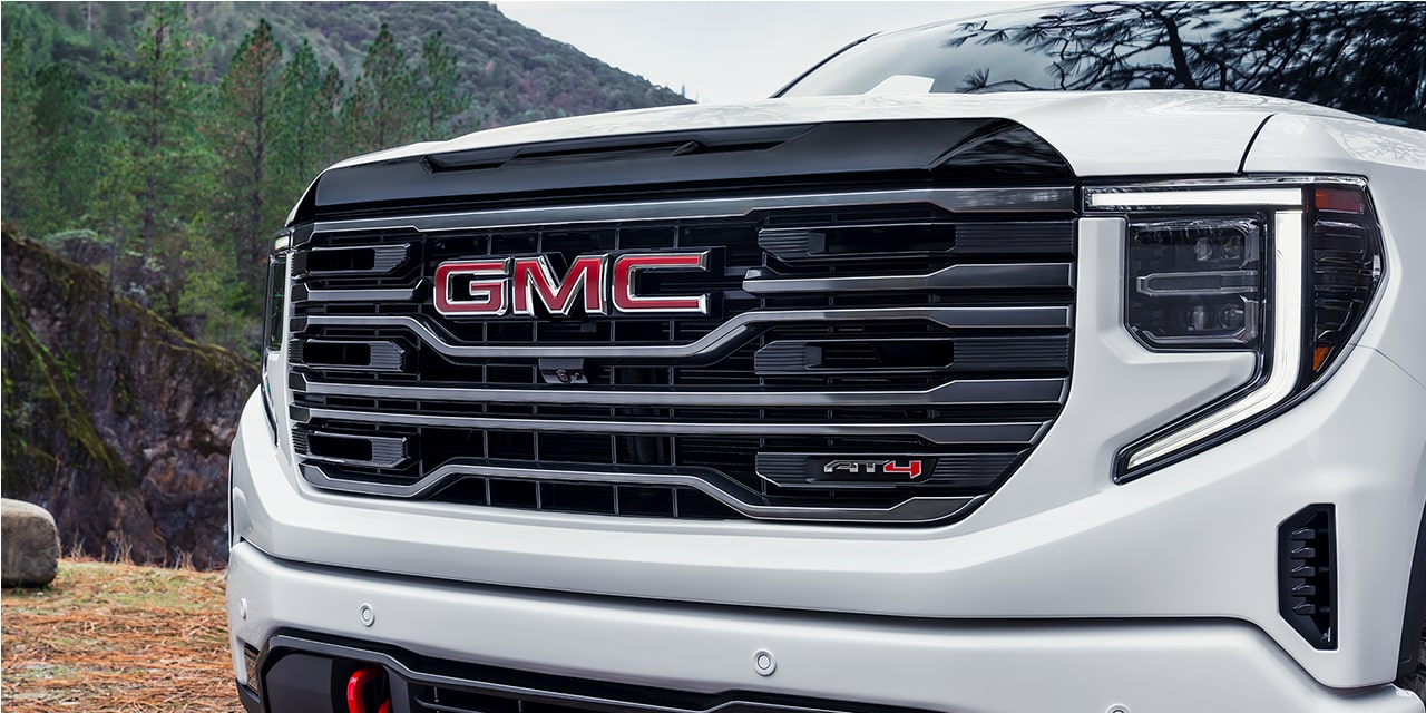 Close-up of the 2026 GMC Sierra 1500 AT4 Front Bumper and Grille.