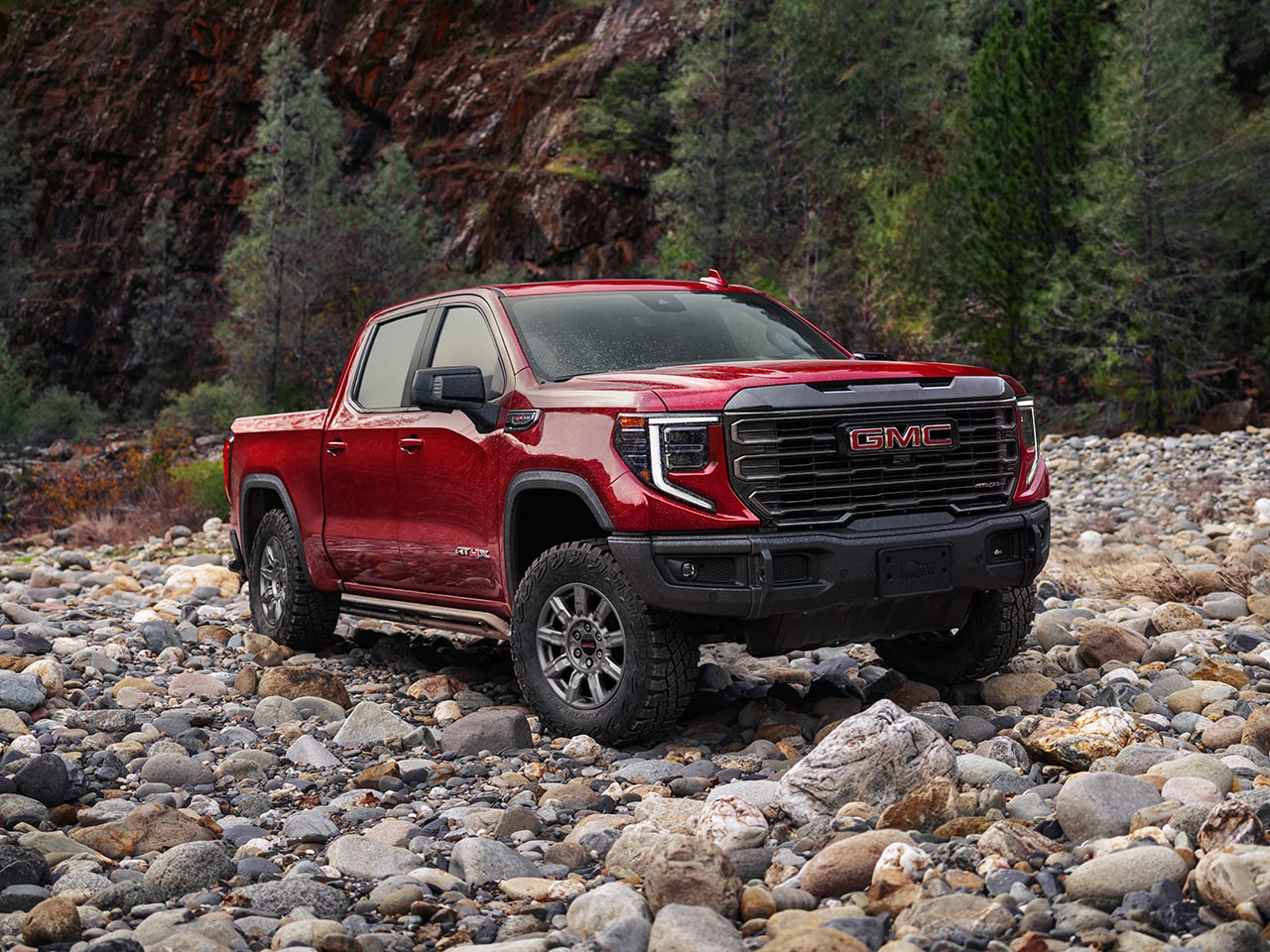 2026 GMC Sierra 1500 AT4 parked on a rugged terrain.