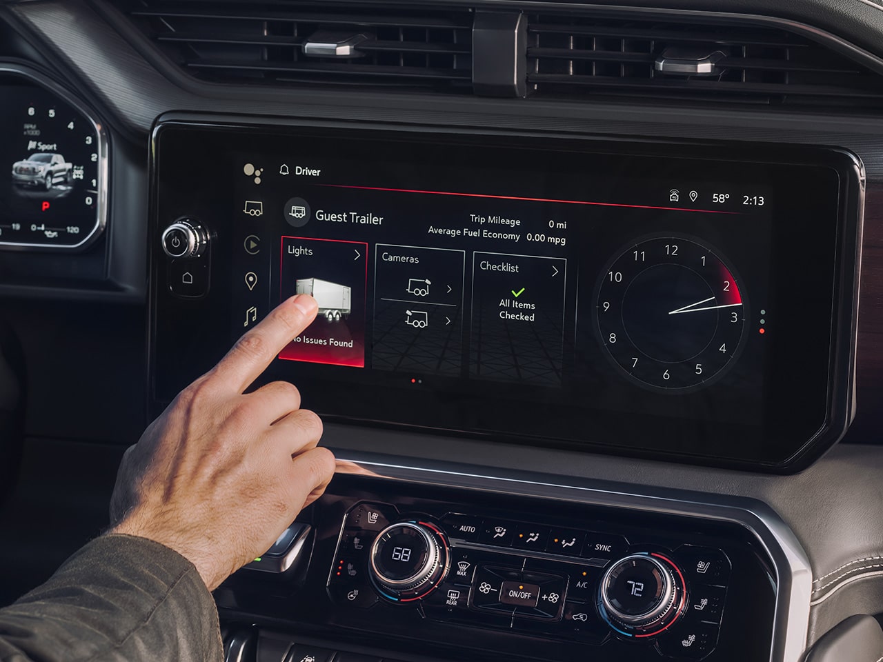 A Driver Pressing an App on the Infotainment System of the 2026 GMC Sierra 1500 Pickup Truck.
