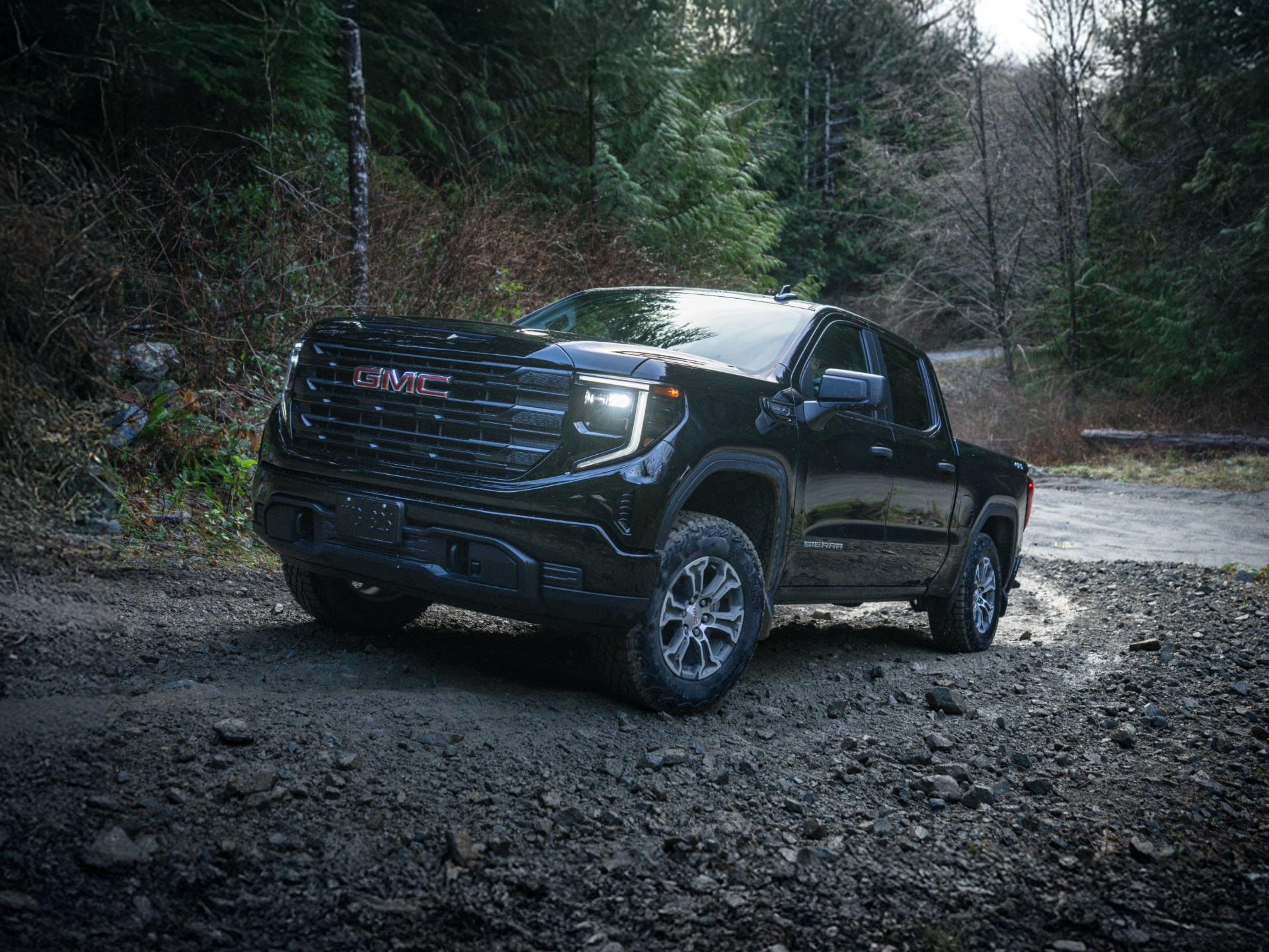 The 2026 GMC Sierra 1500 Towing a Trailer Down the Open Road.