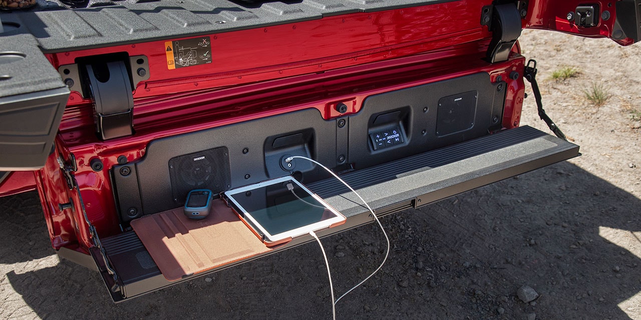Exterior View of an iPad Plugged into the Multipro Audio System on the 2026 GMC Sierra 1500 Pro.
