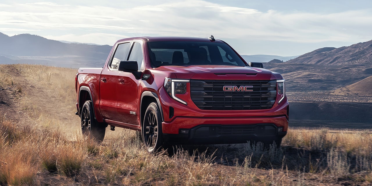 The 2026 GMC Sierra 1500 Pro Parked in a Beautiful Mountain Range.