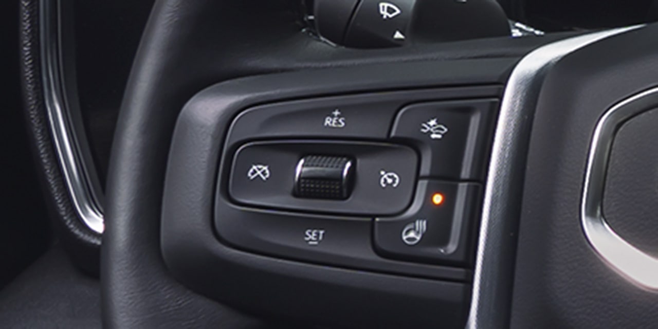 Close-up of the Super Cruise Controls on the Steering Wheel of the 2026 GMC Sierra 1500.
