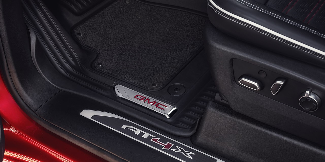 Close-up View of the AT4X Branded Kickplate in a 2026 GMC Sierra HD AT4 Truck.