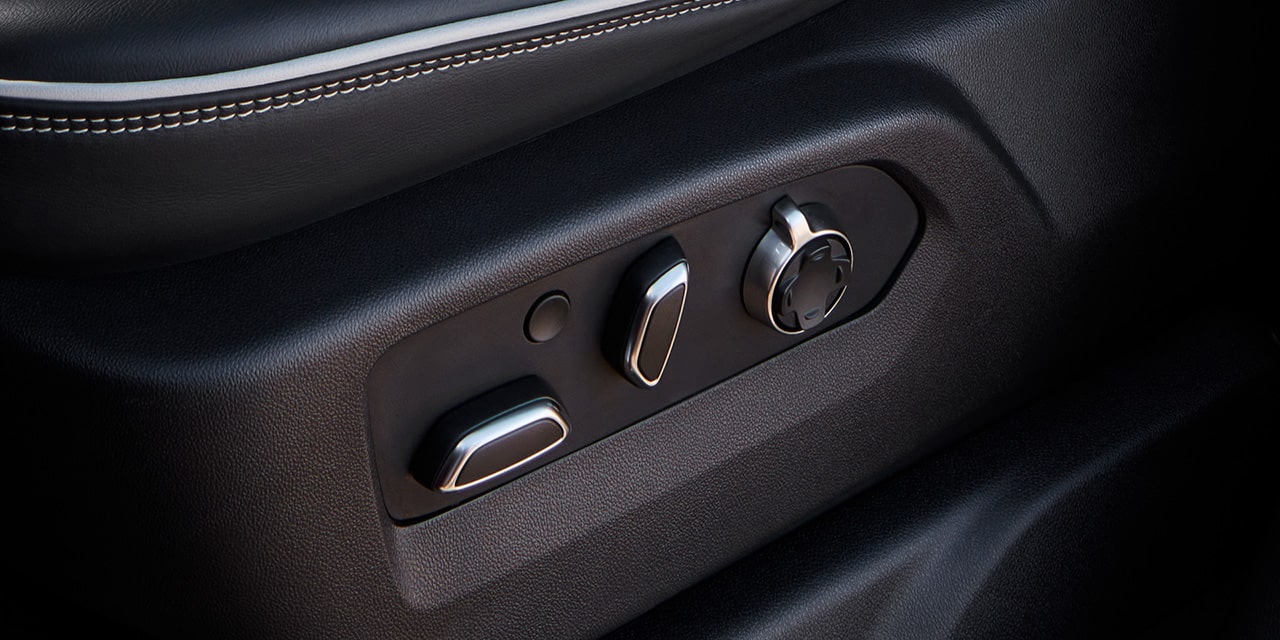 Close-up View of the Seat Controls in a 2026 GMC Sierra HD AT4.