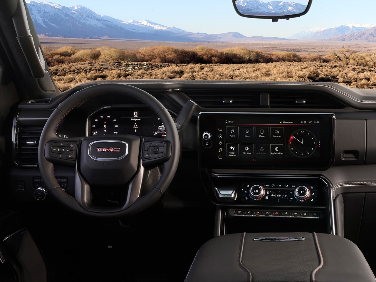 Wide View of the Dashboard, Infotainment System, and Steering Wheel in a 2026 GMC Sierra HD AT4 Truck.