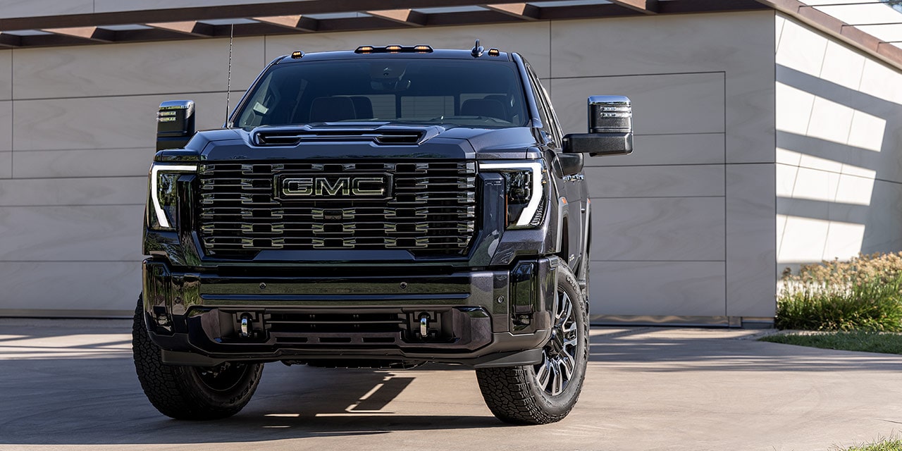 Front View of a 2026 GMC Sierra Denali Ultimate Truck Parked in a Driveway.