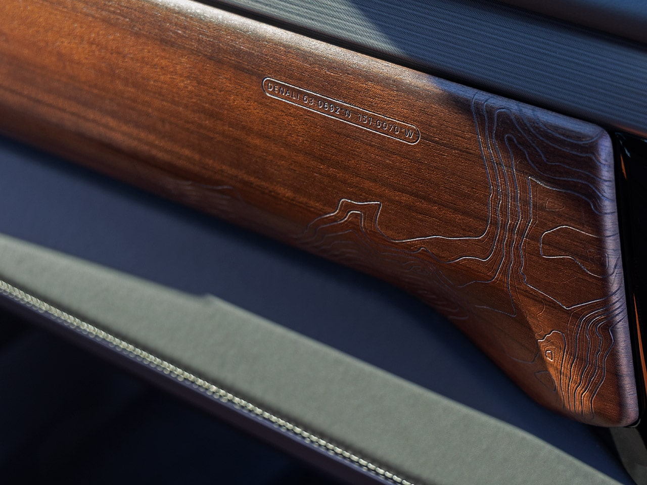 Close-up of the Authentic Walnut Wood Detailing in the 2026 Sierra HD Denali Luxury Truck.