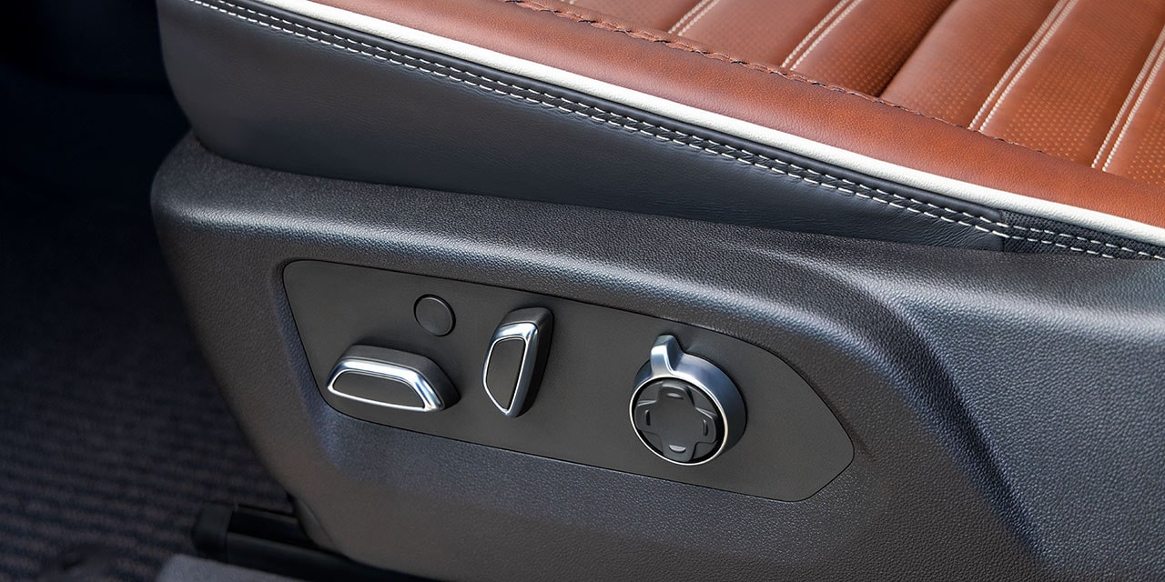Close-up of the Seat Controls in a 2026 GMC Sierra HD Denali Luxury Truck.