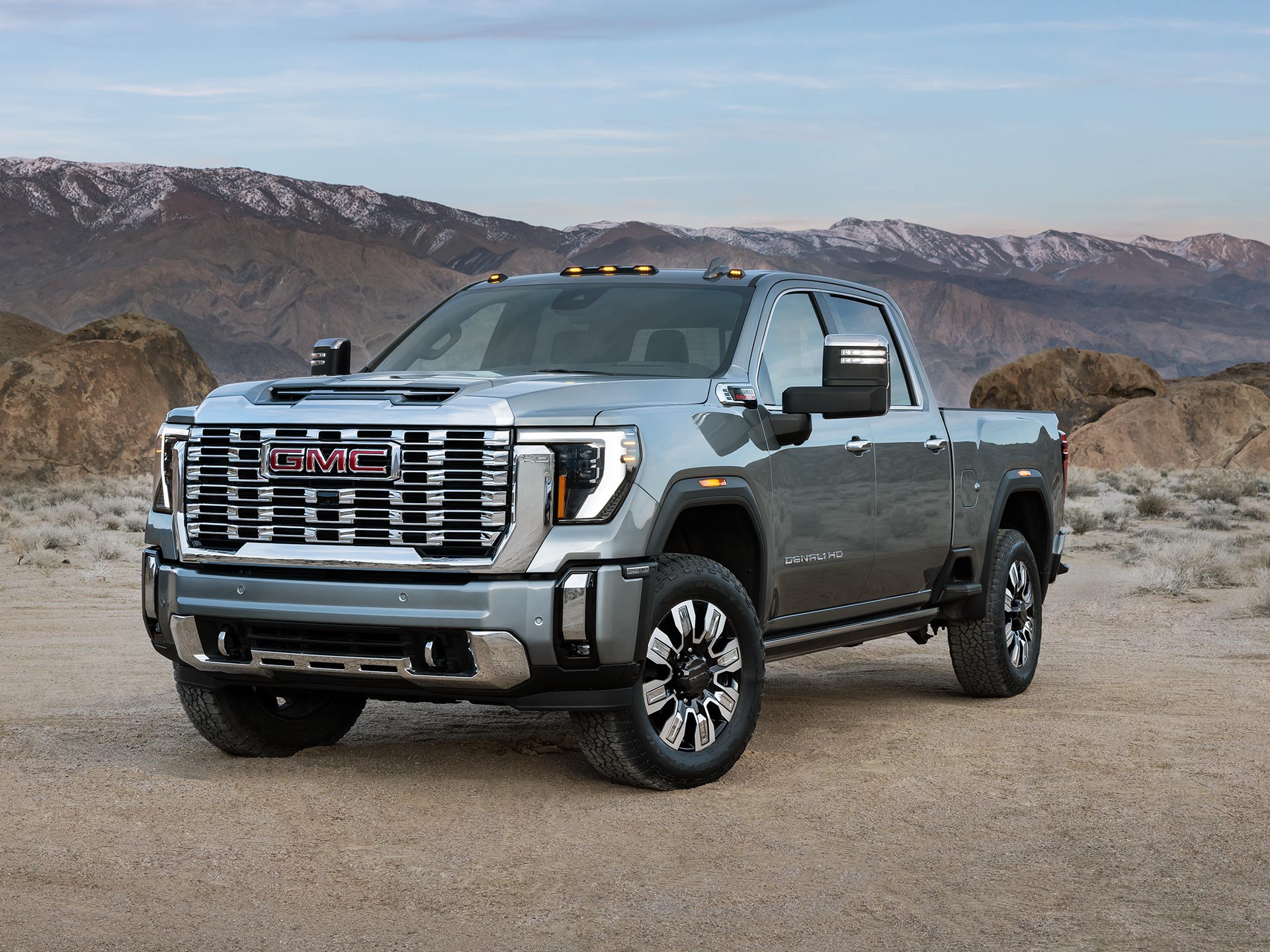 Wide Front Three-Quarters View of the 2026 GMC Sierra HD Denali Luxury Truck in the Desert.