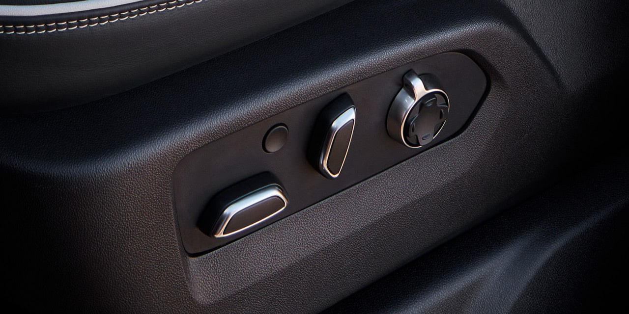 Close-up view of the 2026 GMC Sierra HD Truck Power Front Seat Controls.