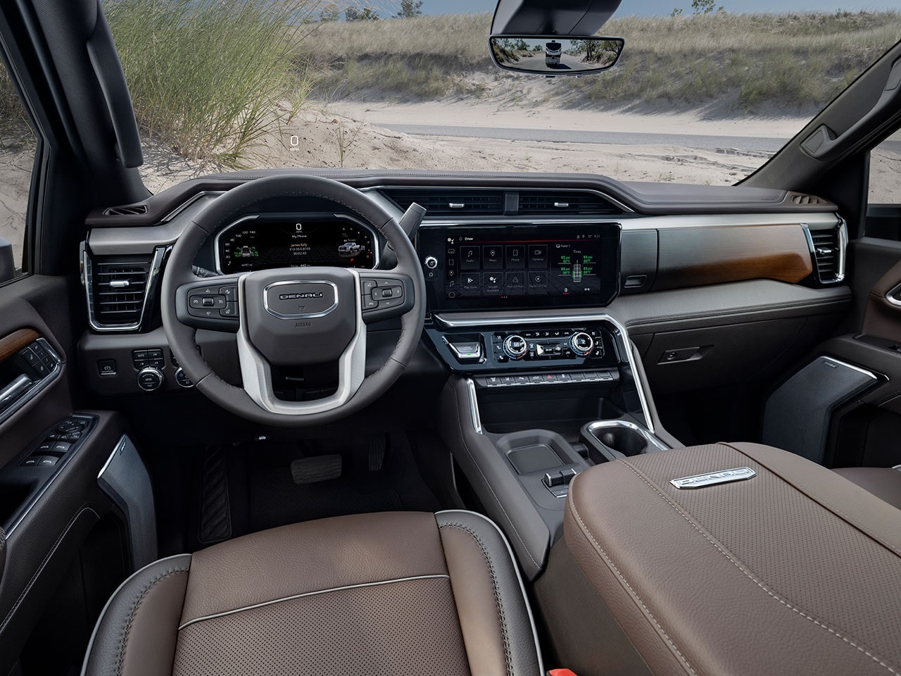 Driver Side Interior View of the Steering Wheel and Dashboard in the 2026 GMC Sierra HD Truck.
