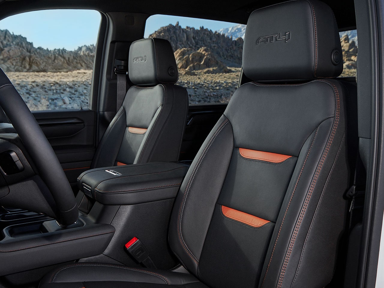 Close-up view of the Jet Black Interior Seats with Kalahari Accents of the  2026 GMC Sierra HD Truck.