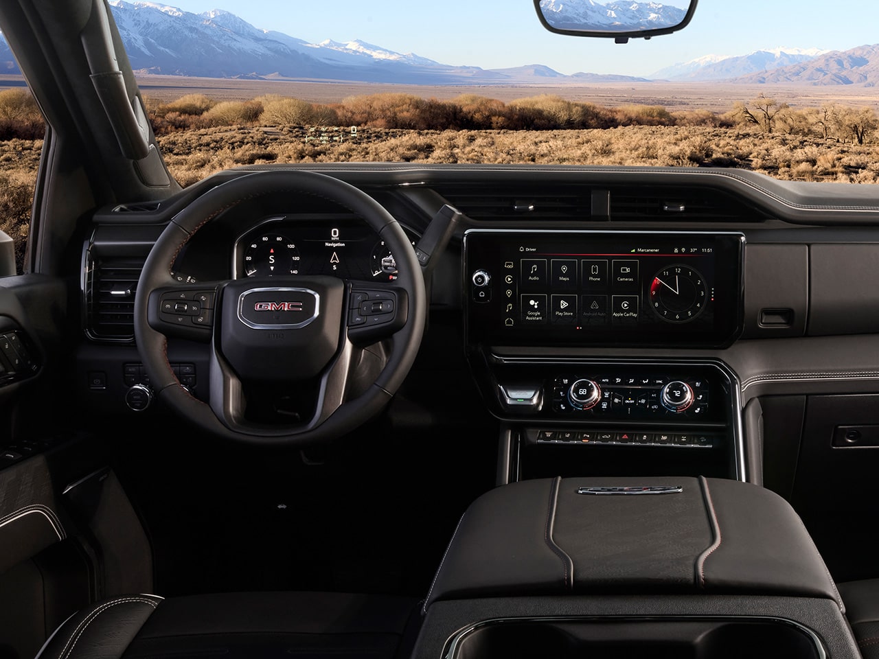 The Interior View of the Steering Wheel and Dashboard in the 2026 GMC Sierra HD Pro Truck.