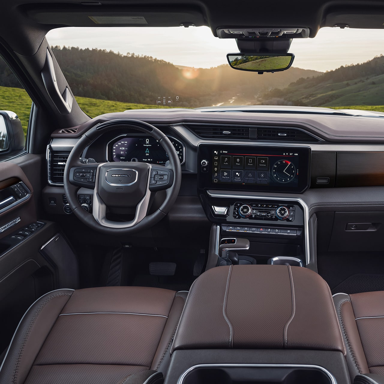 Le volant et l’écran du système d’infodivertissement du pick-up GMC Sierra 1500 2026.