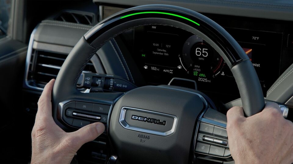 Close-up of Hands on a GMC Yukon Denali Steering Wheel