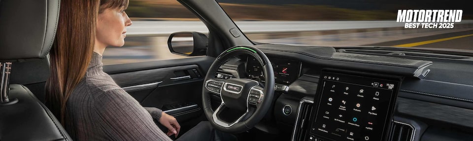 Profile View of a Woman Using Super Cruise Hands-Free Technology in Her GMC