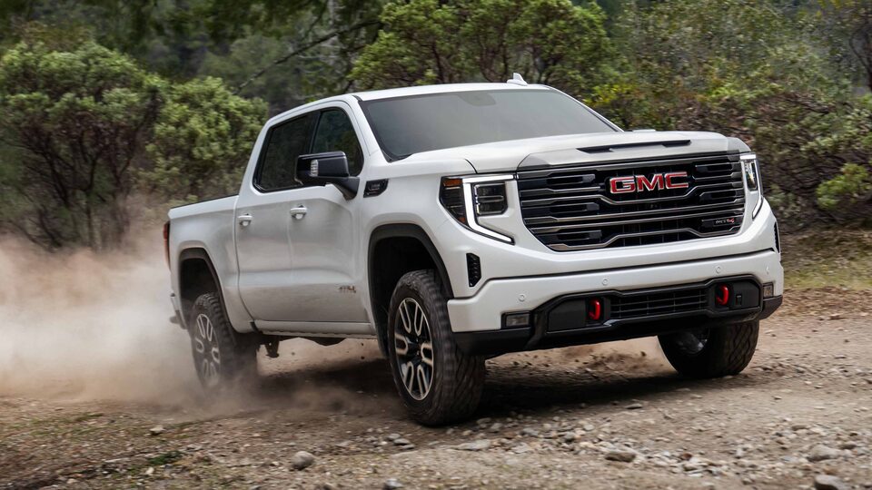 2023 GMC Sierra AT4 Diesel parked in front of Mountain