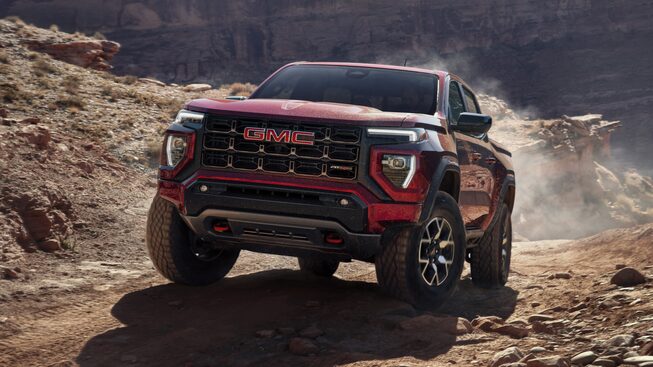 The Canyon AT4X Kipping Up Dirt While Off-Roading in the Mountains